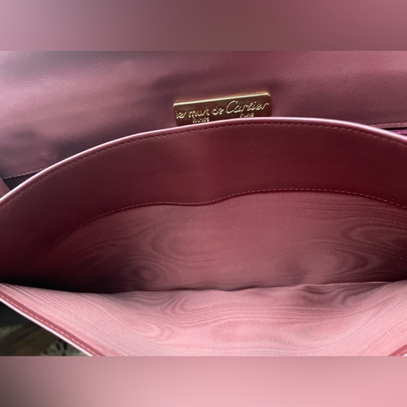 Cartier Clutch Bag Mastline Bordeaux Leather Authentic. Pre- owned condition .